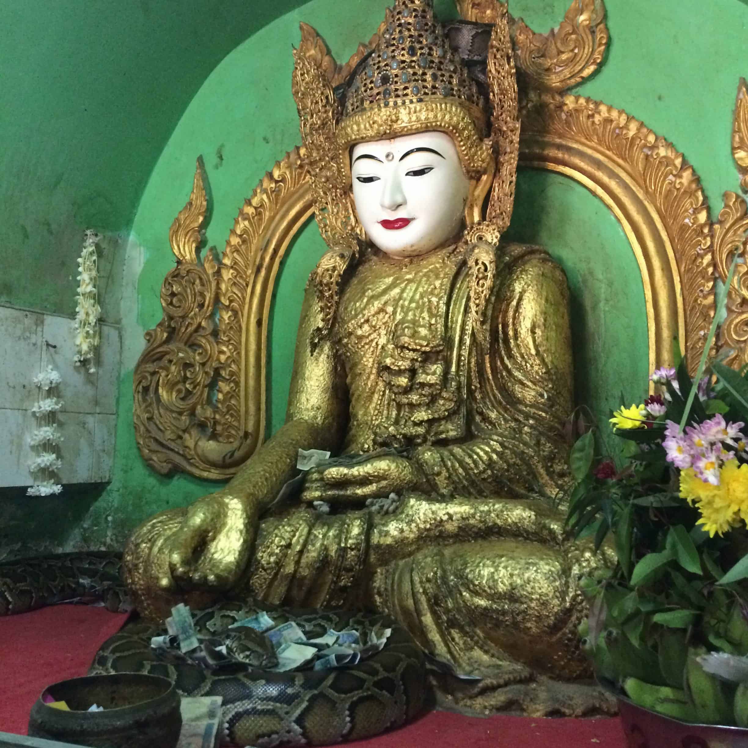 Top Things to Do in Mandalay Myanmar! 14 Buddha statue with snakes in Snake pagoda Mandalay MyanmarÂ