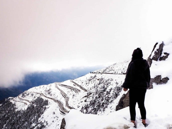 India, Arunachal Pradesh, Sela Pass, female tourist on high altitude road  passing under colourful gateway to Tawang Stock Photo - Alamy