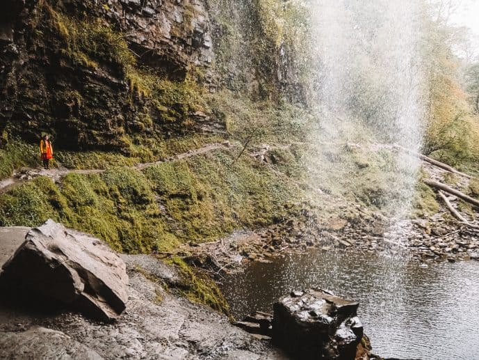 Henrhyd Falls - How to Visit the Batman Filming Location in the Brecon Beacons (2023)! 15 the path behind the waterfall at Henrhyd Falls
